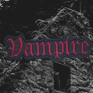 May include: Red embroidered patch with the word "Vampire" in a gothic font.