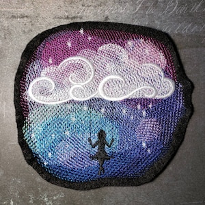 May include: Embroidered patch with a white cloud and a silhouette of a person swinging on a swing against a blue, purple, and pink galaxy background.