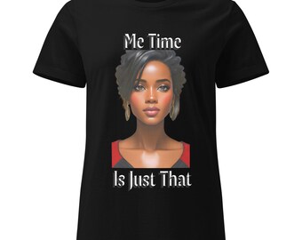 May include: Black t-shirt featuring a portrait of a woman with the text "Me Time Is Just That" in white. The portrait shows a woman with dark hair, gold earrings, and a red and black top.