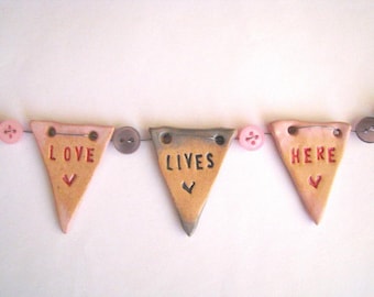 Love Lives Here - mini ceramic bunting