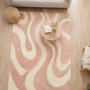 elegant pastel rug for home decor
modern abstract carpet for living room
neutral pastel rug with flowing lines
handmade wool rug in soft colors
boho modern rug with abstract shapes
floor rug enhancing bright interior
statement rug for modern home
smooth pile wool rug for comfort
calming pastel rug for bedroom
stylish rug for minimalist decor
handcrafted abstract wool carpet
aesthetic rug with organic pattern
modern pastel rug for apartment