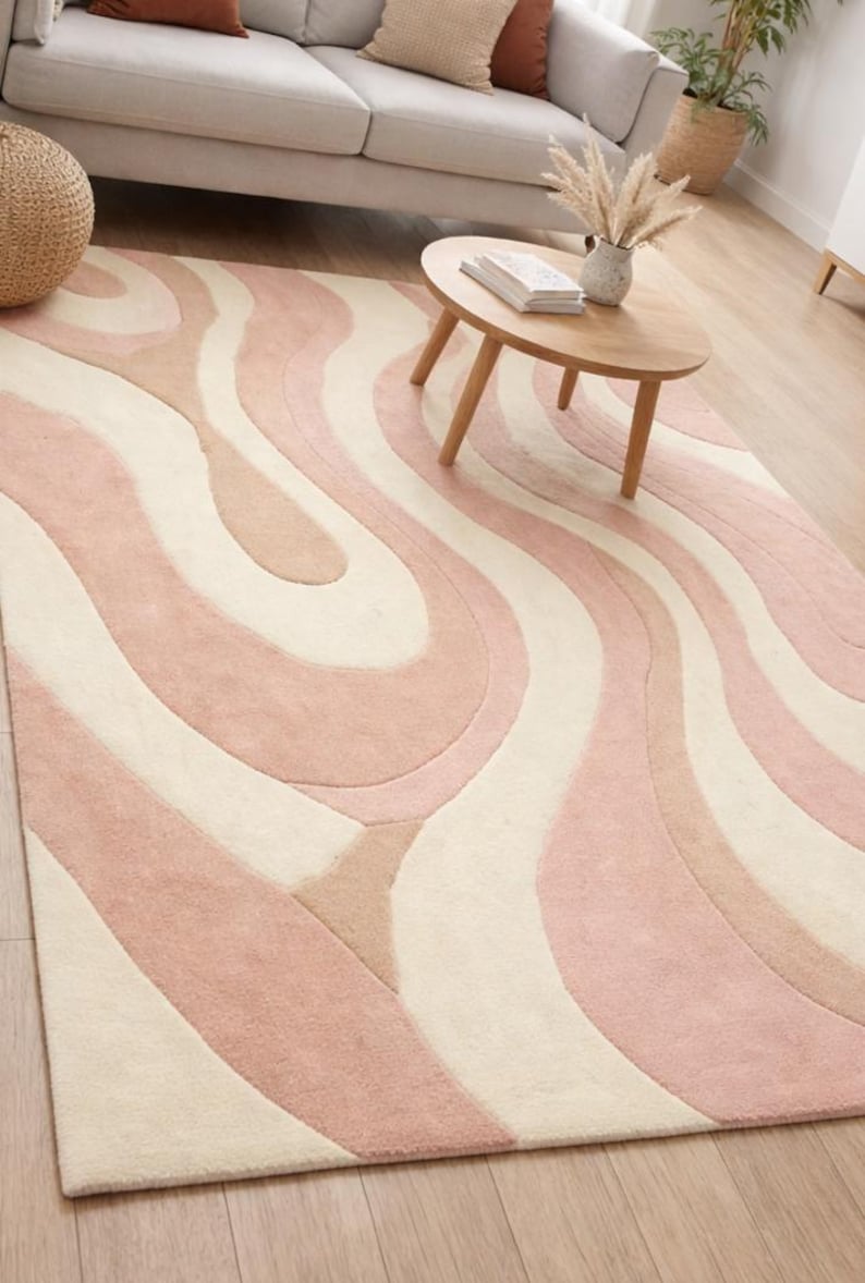floor covering with wavy pattern
calming color palette area rug
living room centerpiece rug
modern decor rug with pastel tones
cozy wool rug for daily use
artistic rug with flowing curves
neutral modern rug for home
soft pastel rug for calm interiors
luxury hand tufted carpet
contemporary abstract rug design
elegant wool rug for home
modern interior styling rug