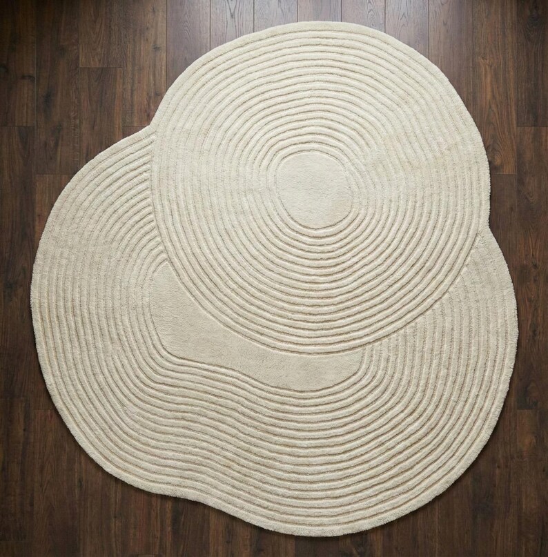 contemporary circle rug,
round rug modern decor,
neutral round carpet,
handmade wool rug round,
round rug cozy interior,
minimal round floor rug,
ivory wool circle rug,
round rug elegant look,
soft texture round rug,
modern lounge round rug,
stylish round carpet,
round rug interior decor,
premium wool round rug,
round rug neutral decor,
handcrafted round rug,
round rug aesthetic home,
living area round rug,