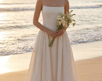Minimalist Backless Linen Wedding Dress with Spaghetti Straps Beach Bride Gown with Pleated Skirt | Elegant Simple Destination Bridal Wear.