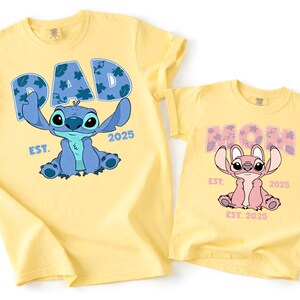 Two yellow t-shirts with the same design featuring the characters Stitch and her offspring, Mom.