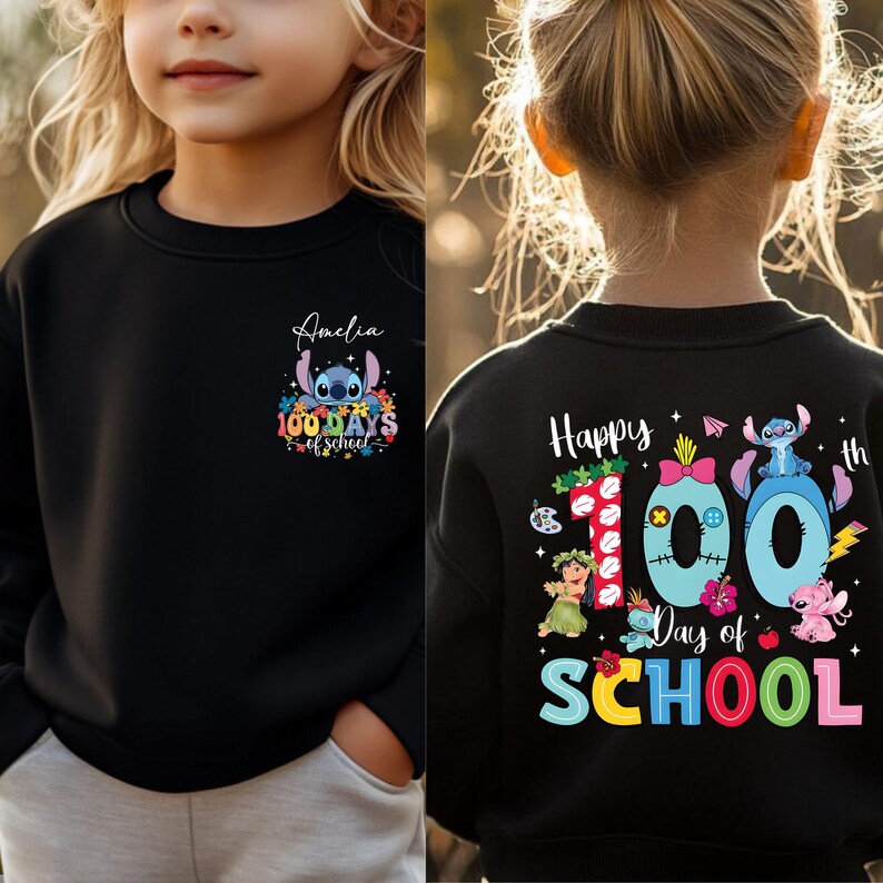 A young girl wearing a black sweater with a colorful design and text on the back.