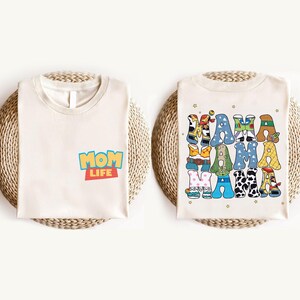 a couple of white shirts sitting on top of a table