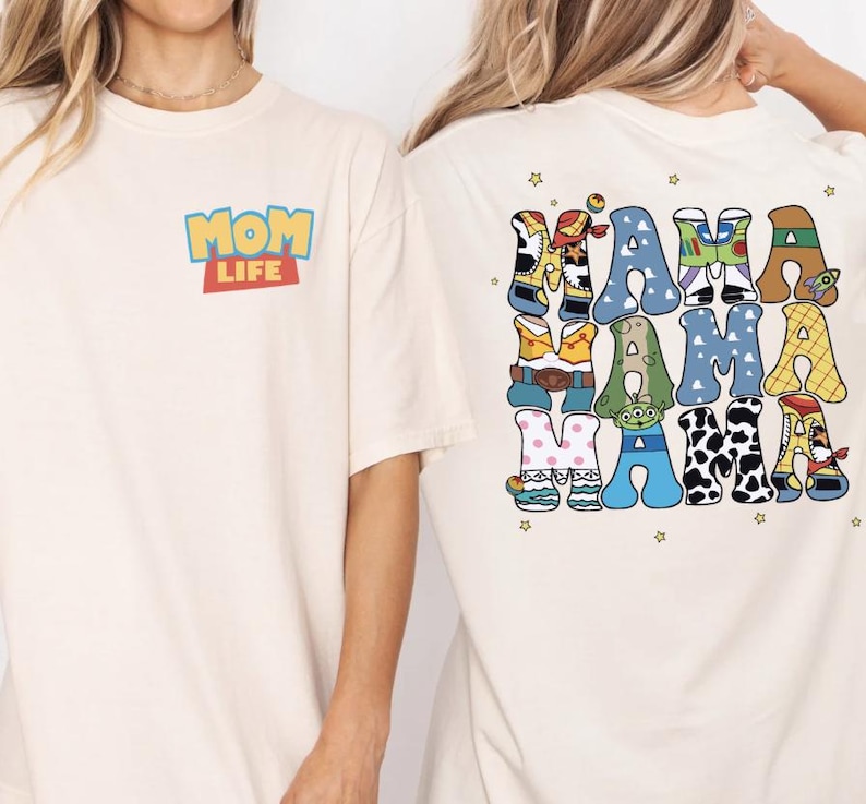 Two women wearing white t-shirts with colorful text and characters on the back.