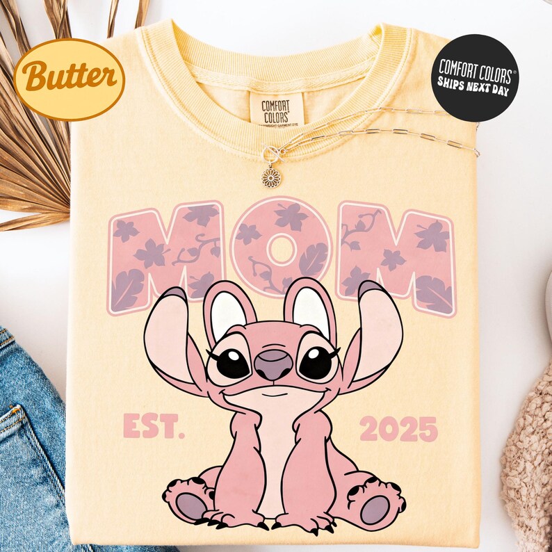 a yellow t-shirt with a cartoon character and text printed on it.