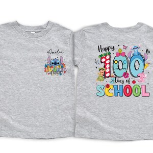 two gray t-shirts with colorful designs and text related to a 100th day of school celebration.
