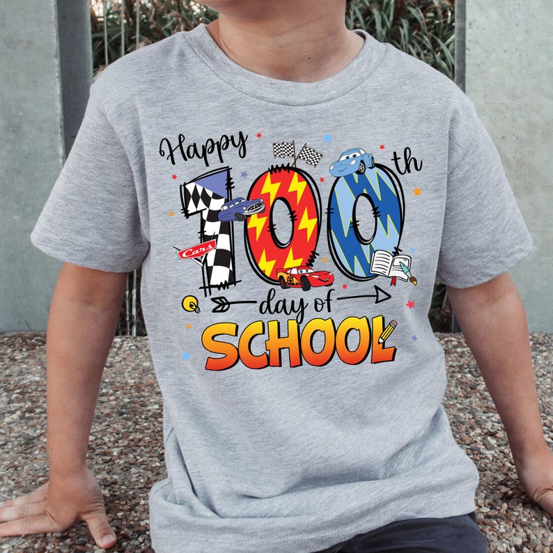A gray t-shirt with a graphic design celebrating the 100th day of school.