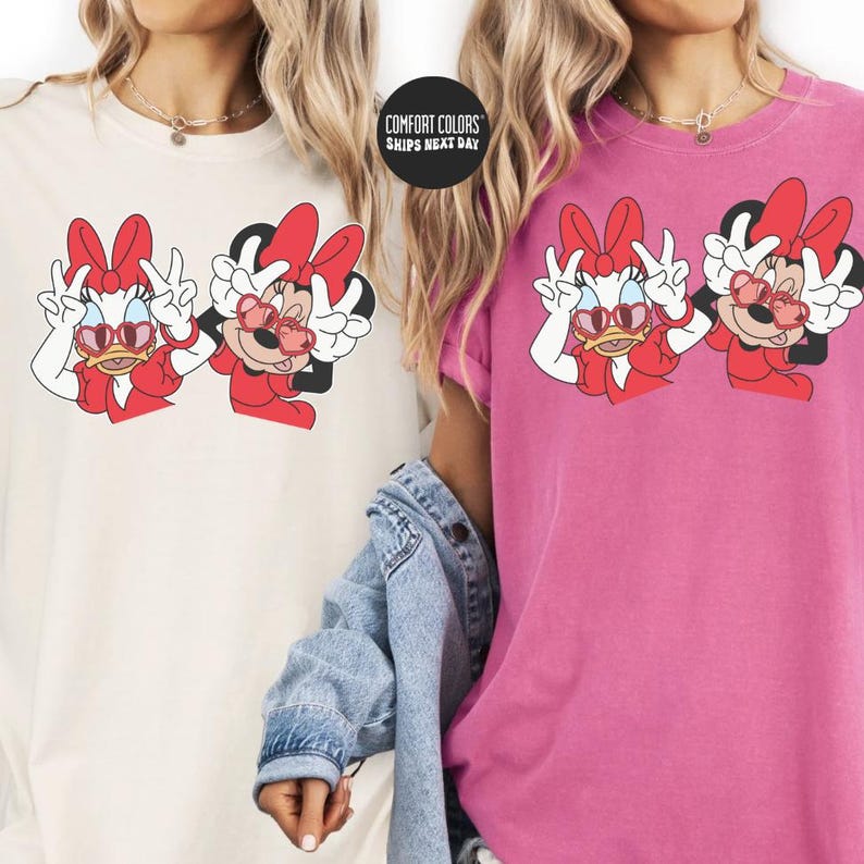 two women wearing t-shirts with Minnie Mouse designs.