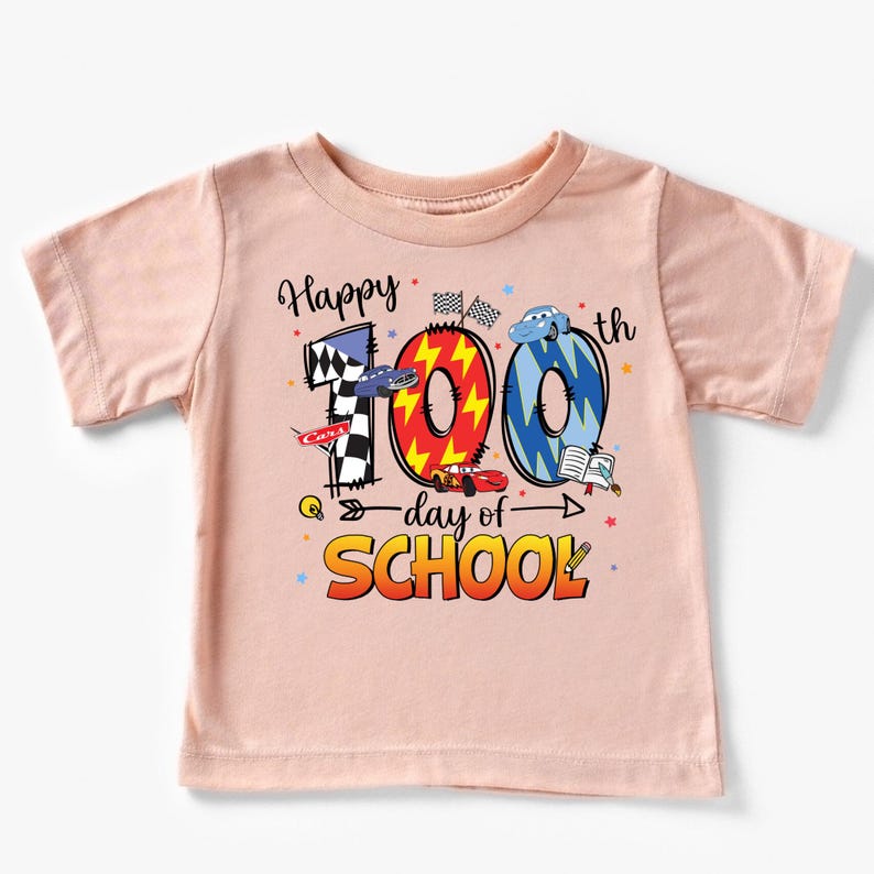 A pink t-shirt with a graphic design celebrating the 100th day of school.