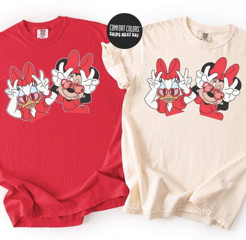 two t-shirts with the same cartoon character design, Minnie Mouse, wearing sunglasses and posing with her friends.