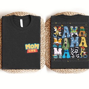 a couple of black shirts sitting on top of a table