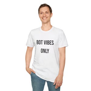May include: White crew neck t-shirt with the text "BOT VIBES ONLY" printed in black. The shirt is made of a soft material and is suitable for casual wear. The t-shirt is a unisex style.