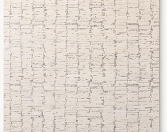 Alfombra de lana color marfil anudada a mano: textura de alto y bajo relieve, alfombra moderna de tonos neutros.