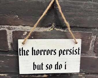 The horrors persist but so do I, Small Wood Sign