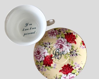 You&#39;ve been Poisoned Tea Cup & Bye Saucer, Yellow and Red Rose Floral Pattern