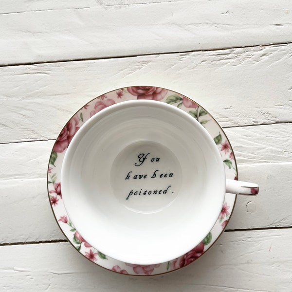 You've been Poisoned Tea Cup & Bye Saucer, White and pink Rose Floral Pattern