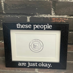 These people are just okay, Black picture frame holds 4x6 or 5x7 picture