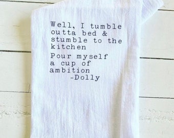 Well, I tumble outta bed & stumble to the kitchen, pour myself a cup of ambition, Dolly Parton, Tea Towel