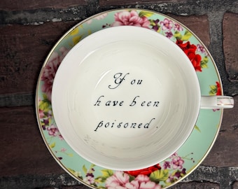 You&#39;ve been Poisoned Tea Cup & Bye Saucer, Green and Red Rose Floral Pattern