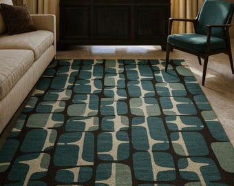 May include: A rectangular area rug with a geometric pattern in shades of teal, beige, and brown. The rug features a repeating design of rounded rectangular shapes, creating a modern and stylish look. The rug is placed in a living room setting.