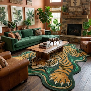 May include: A living room with a green velvet sectional sofa, brown leather armchairs, and a wooden coffee table. A large rug with a tiger design in green, yellow, and orange is on the floor. The room has a fireplace and is decorated with plants and artwork.