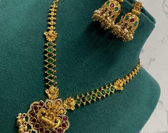 Indian temple jewelry necklace set with matching jhumka earrings, featuring a Goddess Lakshmi pendant and kemp