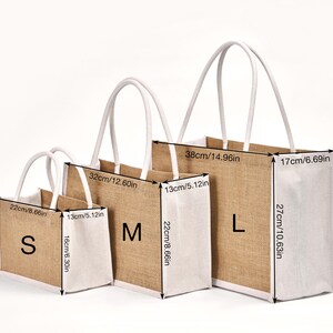 May include: Three jute tote bags in sizes S, M, and L, with white trim and handles. Measurements are provided in inches: S is 8.66" x 6.30" x 5.12", M is 12.60" x 8.66" x 5.12", and L is 14.96" x 10.63" x 6.69".