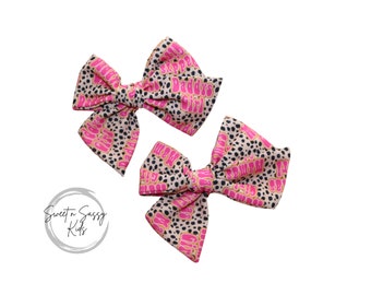 Premium Photo | A little girl with a bow on her hair