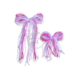 May include: Two decorative hair bows in shades of pink, white, and lavender. The bows are made of layered ribbons and have long, flowing streamers. The bows are of different sizes, with one larger than the other. The bows are set against a white background.