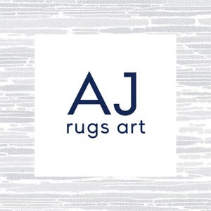 May include: A square logo featuring the dark blue text AJ rugs art centered on a white background. The logo is framed by a light gray border with a horizontal, textured, dashed line pattern that creates a subtle visual contrast around the center.