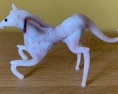 A small, vintage lamp work glass horse possibly Murano.