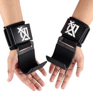 May include: Pair of black weightlifting wrist straps with a hook design. Each strap features a black rectangular patch with a white logo and a hook for gripping weights. The straps are designed to support the wrists during exercise.