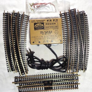 HO Scale Complete train track oval with Brass Track and Model Power power transformer - All you need are the trains! This is pre-owned.