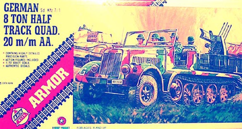 May include: A model kit box for a German 8 Ton Half Track Quad. 20 m/m AA. The box art features a detailed illustration of the vehicle in camouflage colors. The box includes the text "GERMAN So Kte 7/1 8 TON HALF TRACK QUAD. 20 m/m AA."