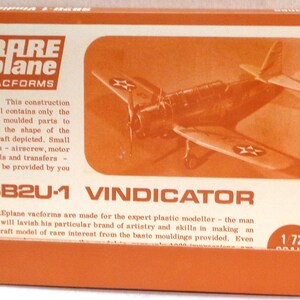 May include: A vintage box for a 1/72 scale plastic model kit of an SB2U-1 Vindicator aircraft. The box is orange and white with a picture of the plane on the front. The text on the box reads "RAREplane VACFORMS".