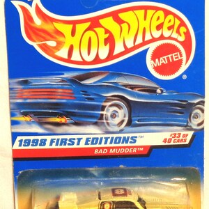 Hotwheels - Bad Mudder - Diecast Model Car - Neuwertig auf der Karte - Die Karte kann Gebrauchsspuren oder kleinere Schäden aufweisen. Bitte siehe Foto für tatsächliche Auto.