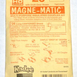 May include: A package for a Kadee HO scale Magne-Matic multi-purpose insulated coupler kit. The package is tan with orange text and illustrations. Includes adaptors and draft gear boxes. Made in the U.S.A.