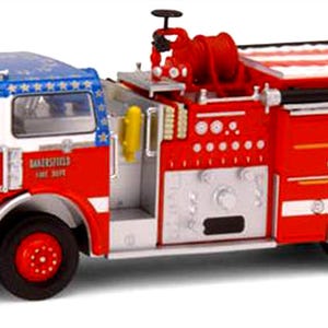 May include: A detailed model fire engine from the Bakersfield Fire Dept. The truck is red and white with a blue roof decorated with white stars. The front of the truck displays the text "Bakersfield Fire Dept." and "Engine Co. 1".