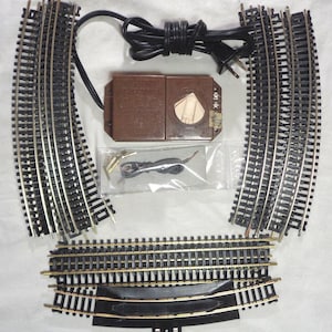 HO Scale Complete train track oval with Brass Track and Bachmann power transformer - All you need are the trains! This is pre-owned.