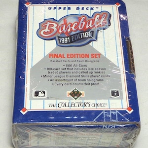 May include: A sealed 1991 Upper Deck Baseball Final Edition Set. The box is wrapped in clear plastic and features a blue and white design with the words "Baseball" and "1991 Edition". The box includes baseball cards and team holograms.