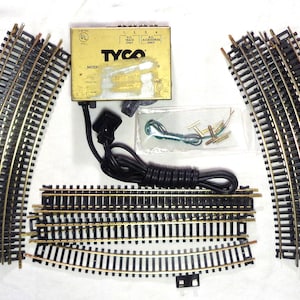 HO Scale Complete train track oval with Brass Track and Tyco power transformer - All you need are the trains! This is pre-owned.