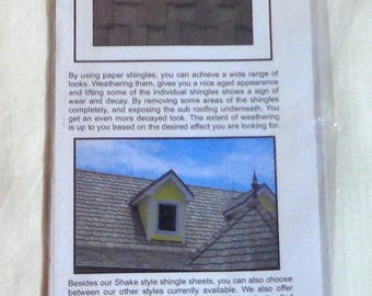 May include: A package of two sheets of HO scale shake style paper roofing shingles for model railroading. The package is yellow with black text and a picture of the shingles. The text on the package reads "LASER-ART Structures by Branchline Trains, BRA 902, HO Scale Shake Style Roofing Shingles, http://www.branchline-trains.com".