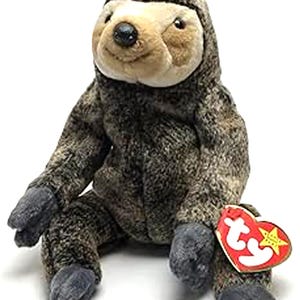 May include: A plush sloth toy with a brown and tan color scheme. The sloth has a smiling face, gray paws, and a red heart-shaped tag with a star. The toy is designed to sit upright.