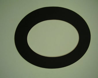 May include: A black circular frame with a white oval cutout in the center.