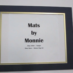 May include: A black frame with a gold border surrounds a white paper with the text "Mats by Monnie" and the text "Ebay Seller - Tango" and "Ebay Store - Skinny Dog Art".
