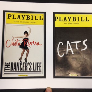 May include: Two framed Playbill covers. One features Chita Rivera in "The Dancer's Life" with a yellow top banner. The other is a black cover with the word "CATS" in white, also with a yellow top banner.